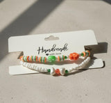 Handmade 2-Piece Bracelet Set with White Beads, Orange & Green Accents, Flower & Smiley Charms – Gift Jewelry, Boho Chic Style