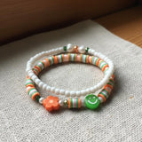 Handmade 2-Piece Bracelet Set with White Beads, Orange & Green Accents, Flower & Smiley Charms – Gift Jewelry, Boho Chic Style