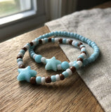 Handmade Beaded Friendship Bracelet – Light Blue & White Beads with Brown Accents, Two Blue Star Beads, Playful Gift for Kids/Teens