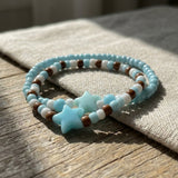Handmade Beaded Friendship Bracelet – Light Blue & White Beads with Brown Accents, Two Blue Star Beads, Playful Gift for Kids/Teens