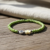 Green Seed Bead Daisy Bracelet with Initial O, Cute Personalized Stretch Jewelry, Symbol of Growth & Happiness Gift