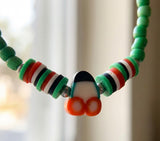 Boho Beaded Bracelet with Cherry Charm – Green Beads & Red-White-Green Accents, Handmade Elastic Jewelry