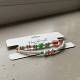 Handmade 2-Piece Bracelet Set with White Beads, Orange & Green Accents, Flower & Smiley Charms – Gift Jewelry, Boho Chic Style