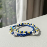 Handmade Blue Yellow Beaded Bracelet Set, Heart and Butterfly Charms, Pearl-Like Accents, Playful Boho Jewelry