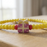 Handmade Yellow Beaded Bracelet, Pink Floral Accent, Playful Casual Jewelry