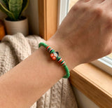 Boho Beaded Bracelet with Cherry Charm – Green Beads & Red-White-Green Accents, Handmade Elastic Jewelry