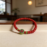Handmade Red Beaded Bracelet, Green Accents, Floral Centerpiece Playful Boho Jewelry