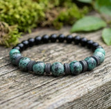 Handmade Boho Bracelet – Greenish-Gray Speckled K2-Style Beads with Dark Spacer Accents & Gray Heishi